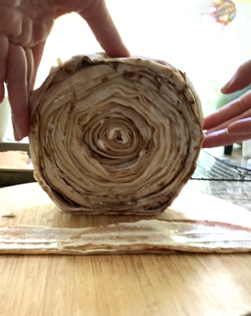 Rolling the Strawberries and Cream Rollup Crepe Cake