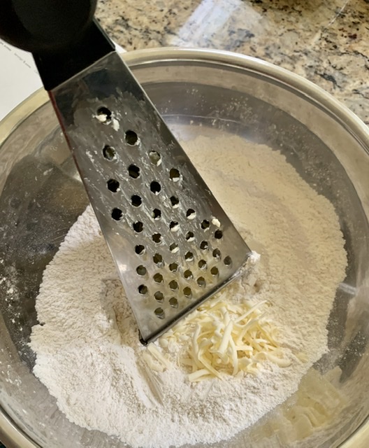 Grating Butter directly into the flour