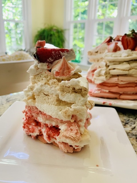 A slice of Pink Ombré Pavlova Cloud Cake