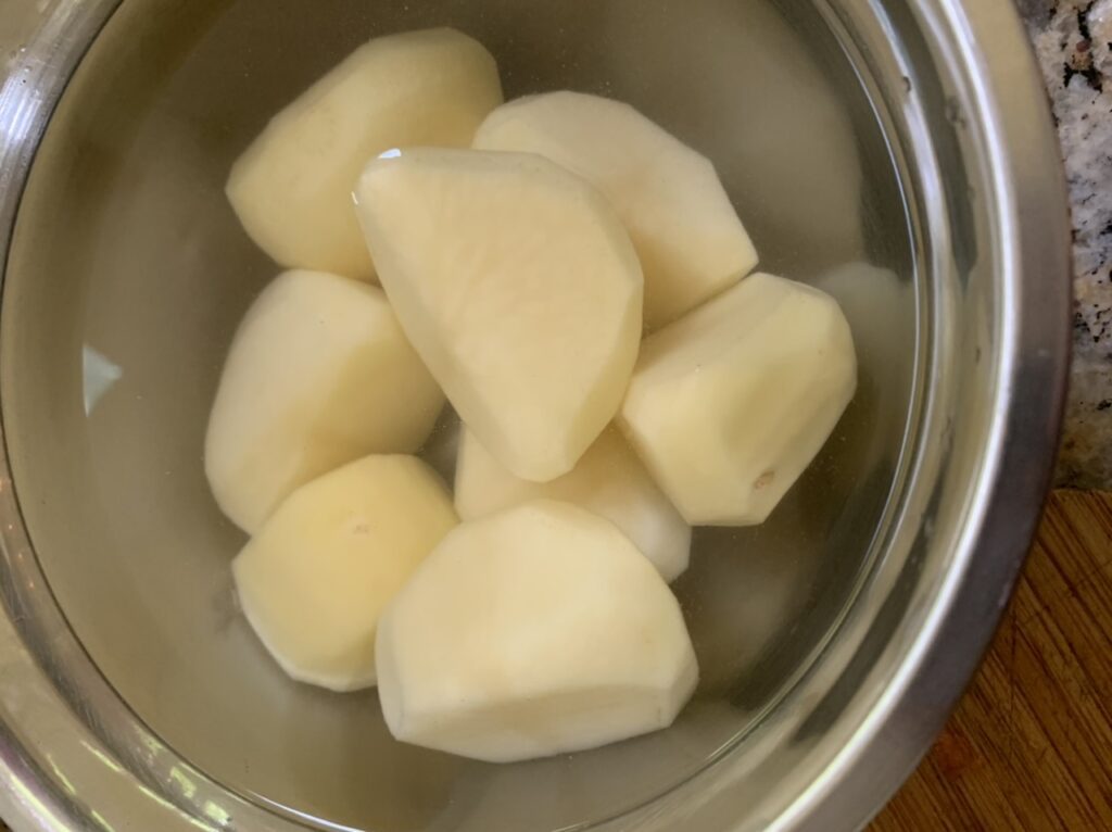 Soak the potatoes to remove starch