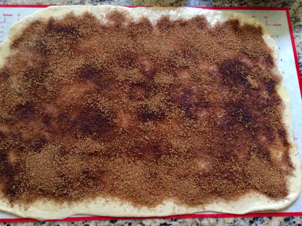 Sprinkle cinnamon sugar on top of buttered dough