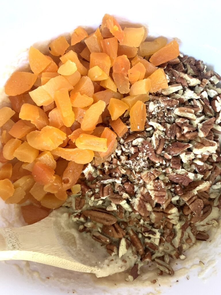 Mixing in the chopped apricots and pecans