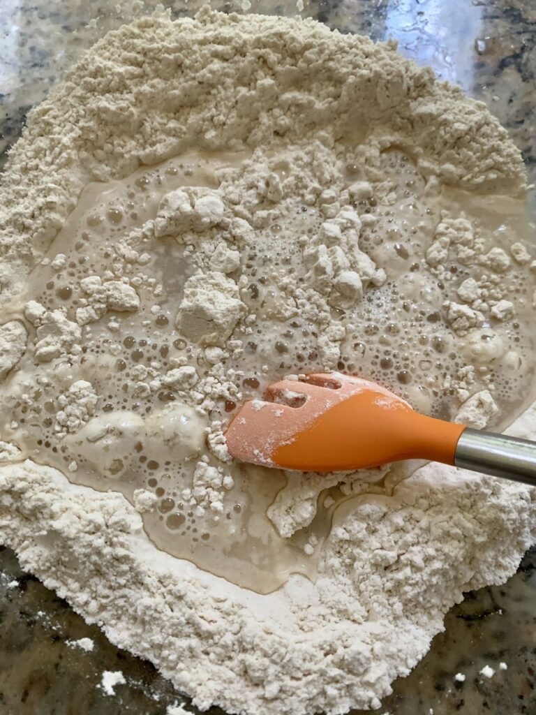 Adding water to Ingredients for Easy No Knead Bread