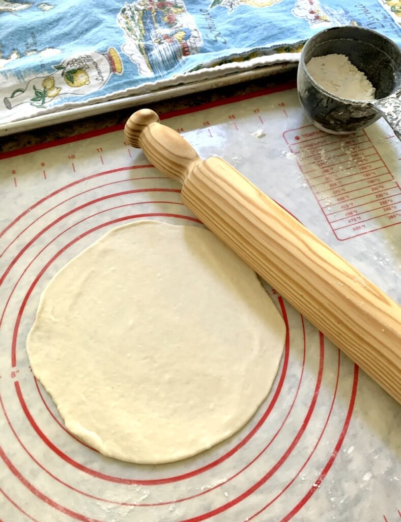 Roll tortilla dough into a round 