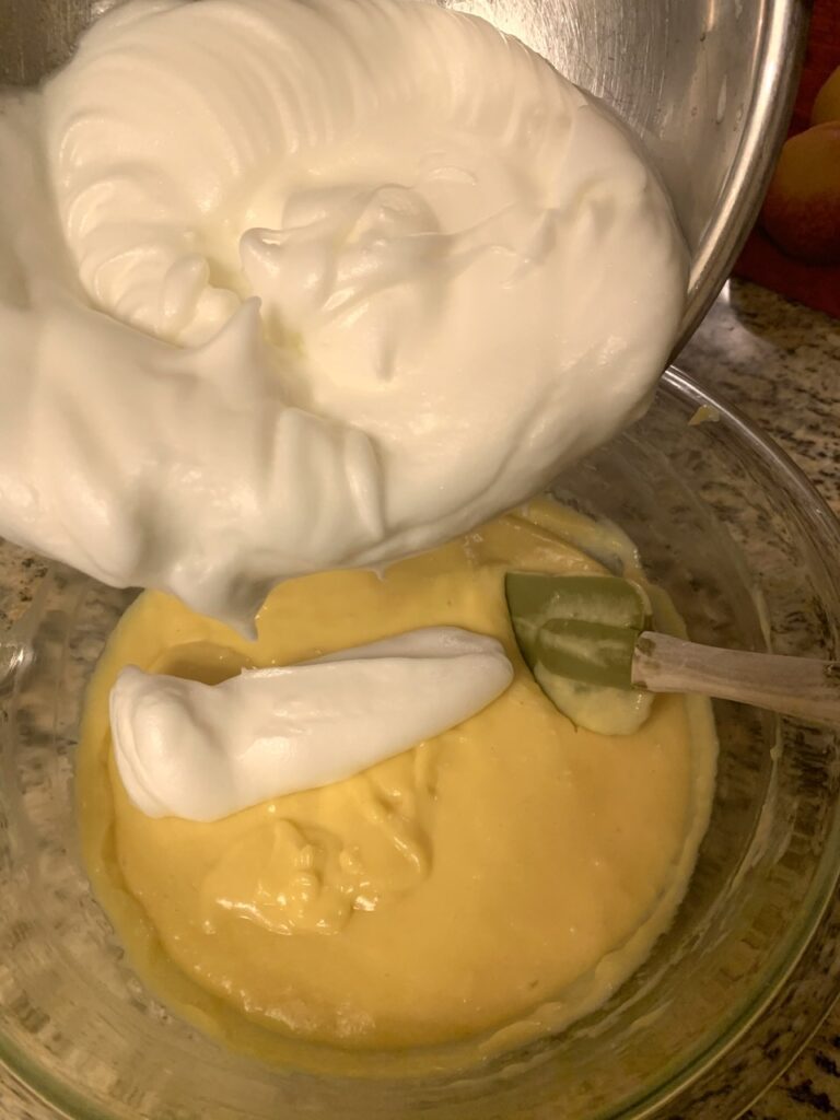 folding egg whites into the cheese egg yolk  mixture 