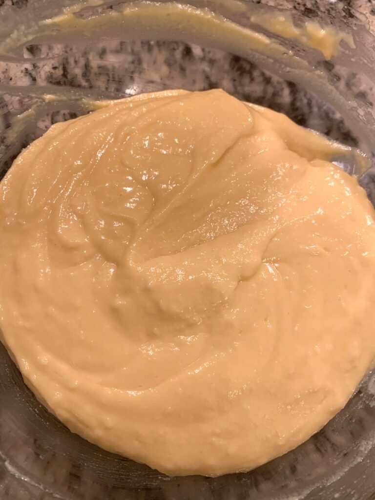 mixing egg yolks into cheese mixture