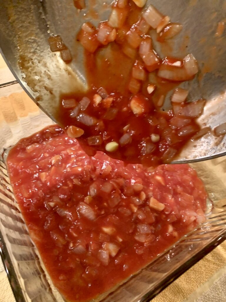 Pouring the sauce on the bottom of pan