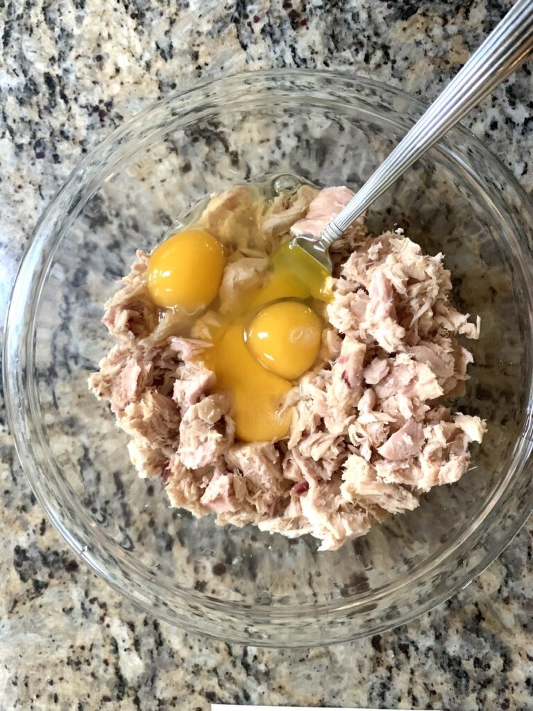 Adding eggs to tuna