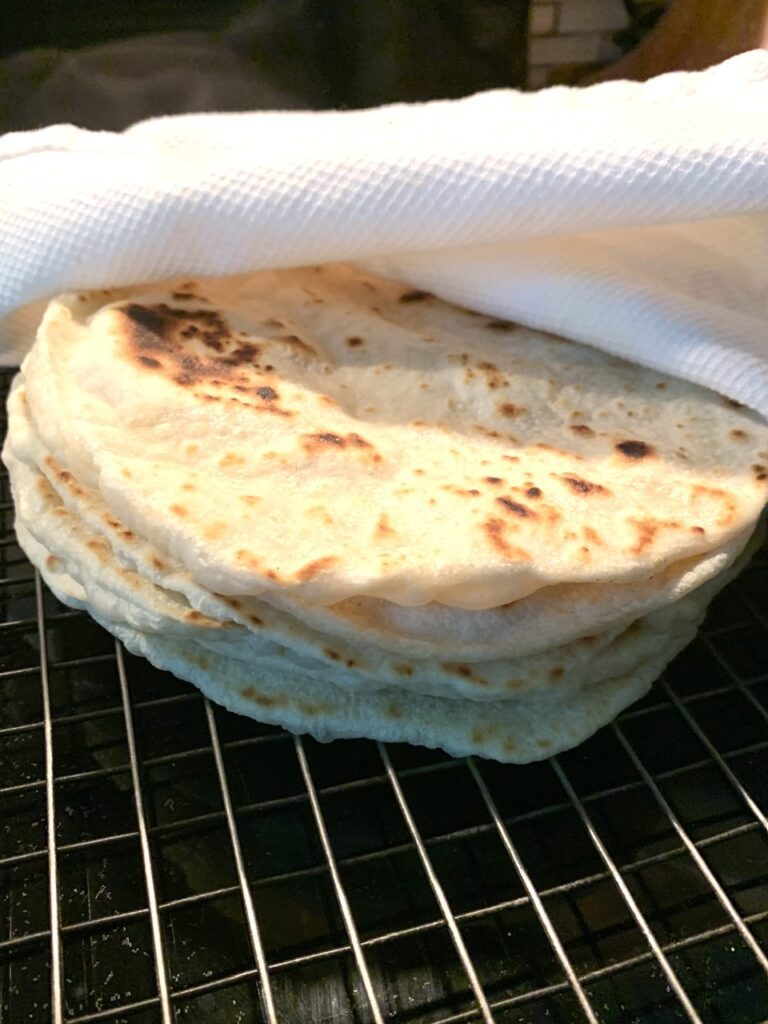 Keep tortilla warm under kitchen towel