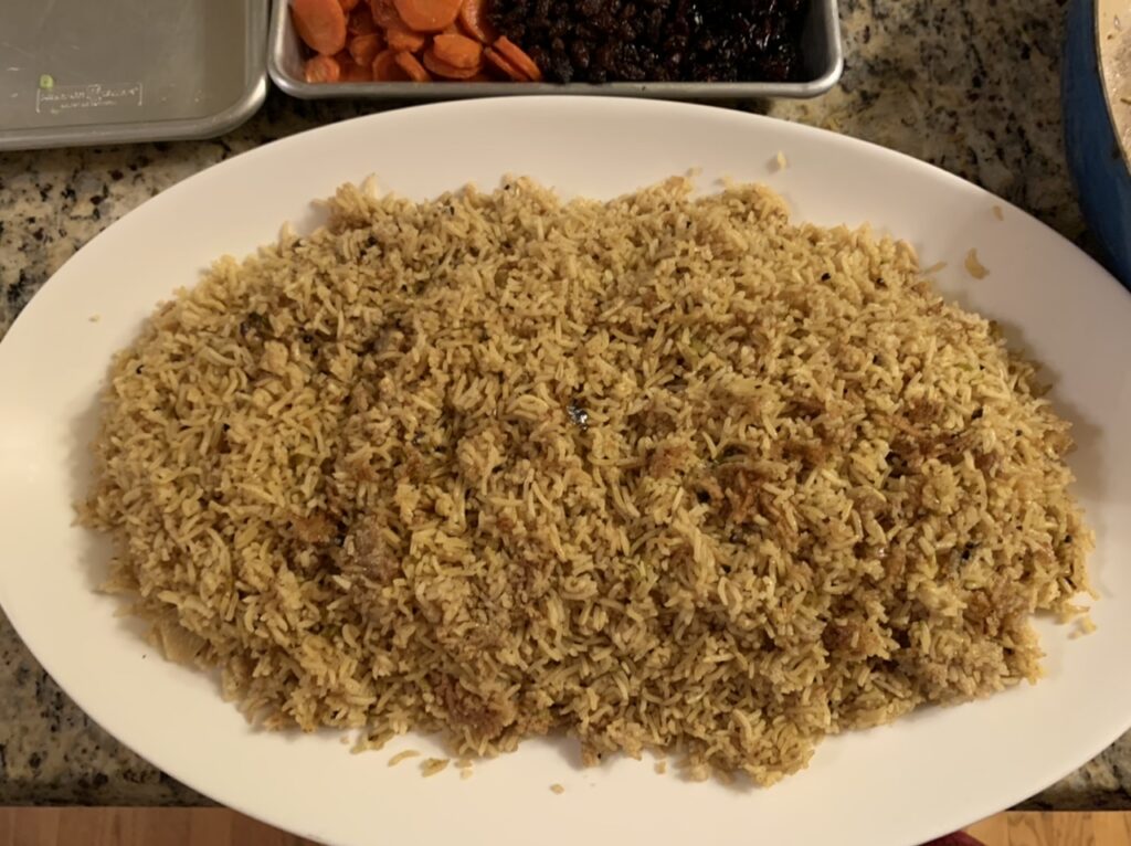 Spooning rice onto serving platter 