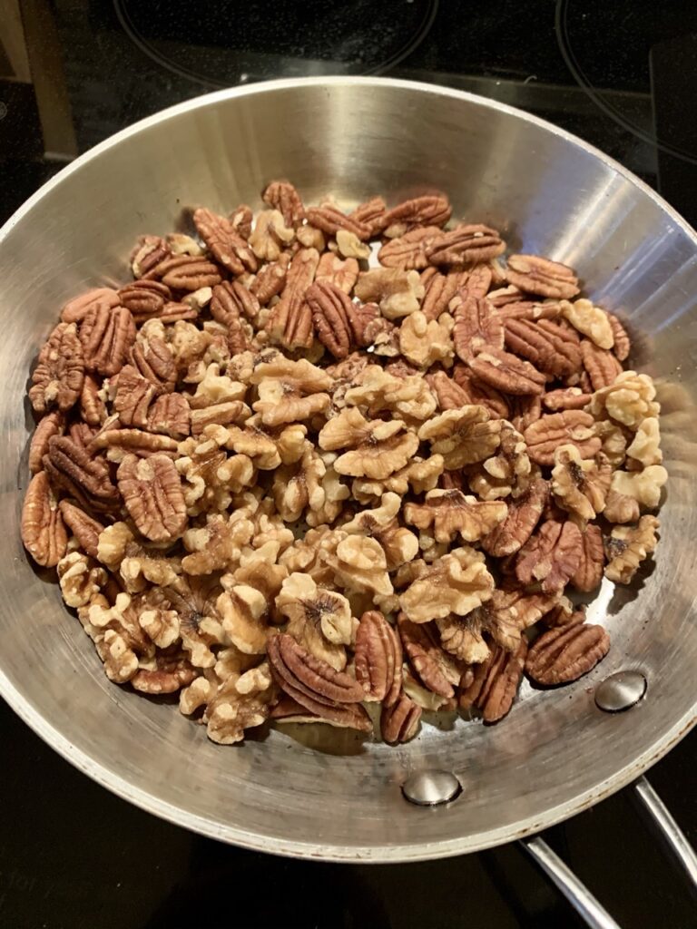 Toasting walnuts and pecans for Easy Pecan Walnut Pie
