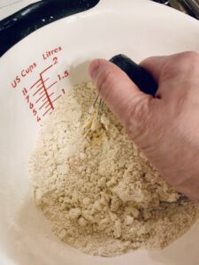 Blending cold butter into the flour mixture