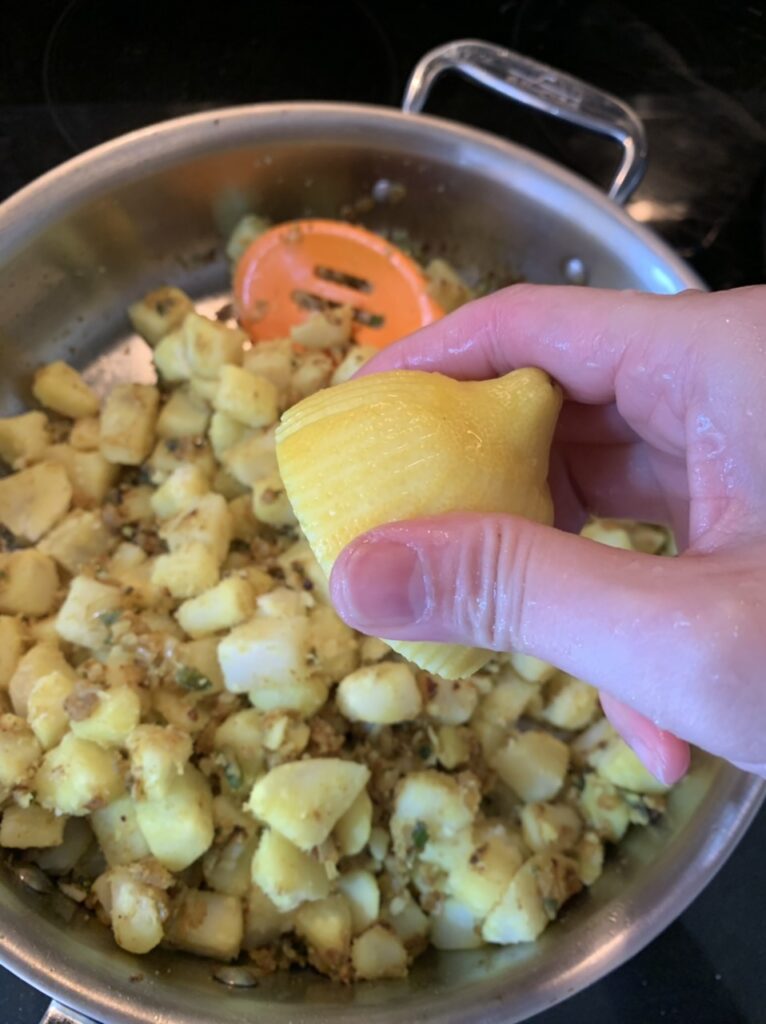 Preparing filling for Spicy Potato Samosas