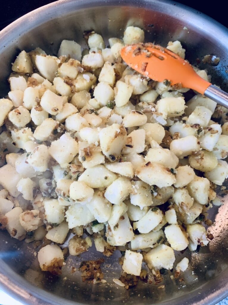 Preparing filling for Spicy Potato Samosas