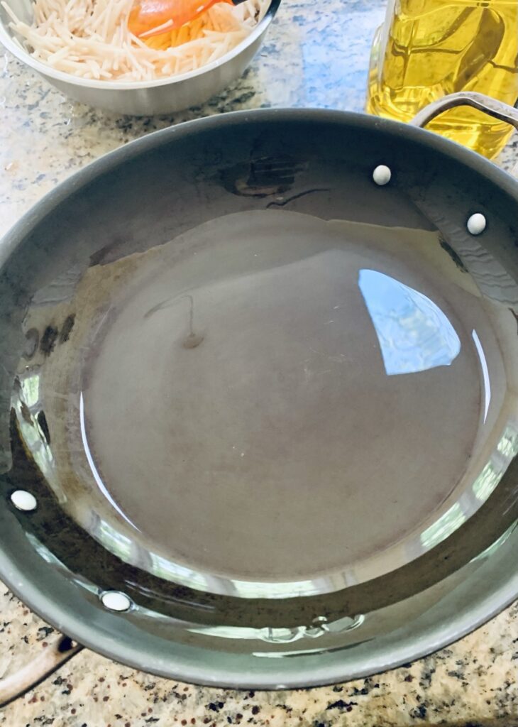 Coat pan with oil before putting into preheated oven
